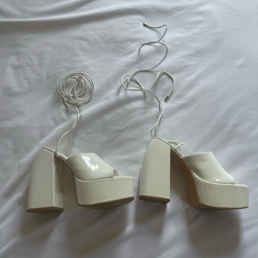 Size 7 Forever 21 straps heels. Lightly used. Small tear in the back.